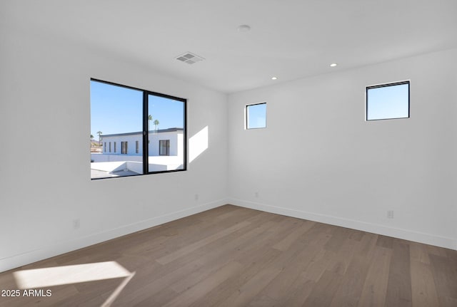 unfurnished room with light hardwood / wood-style flooring