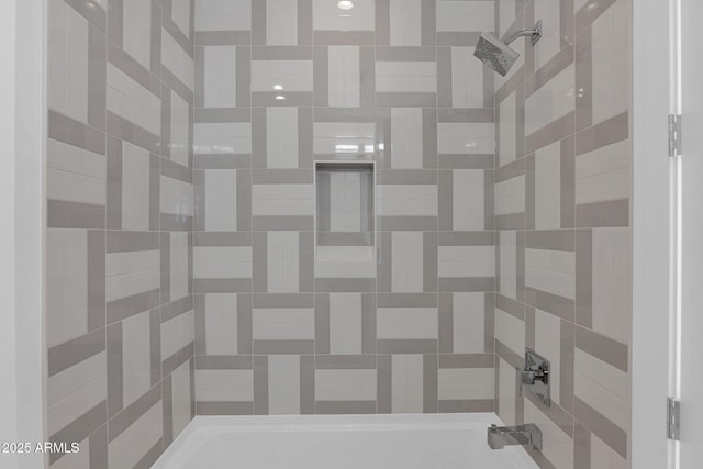 interior details featuring shower / bath combination