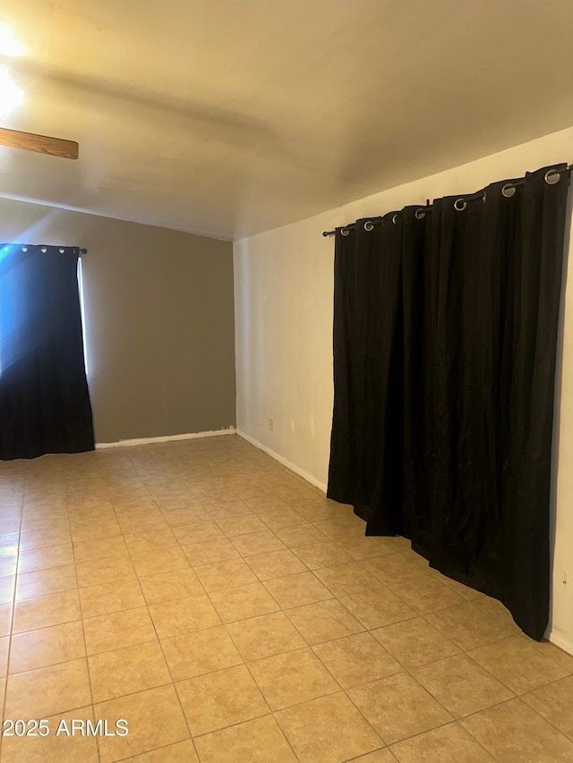 spare room featuring light tile patterned floors