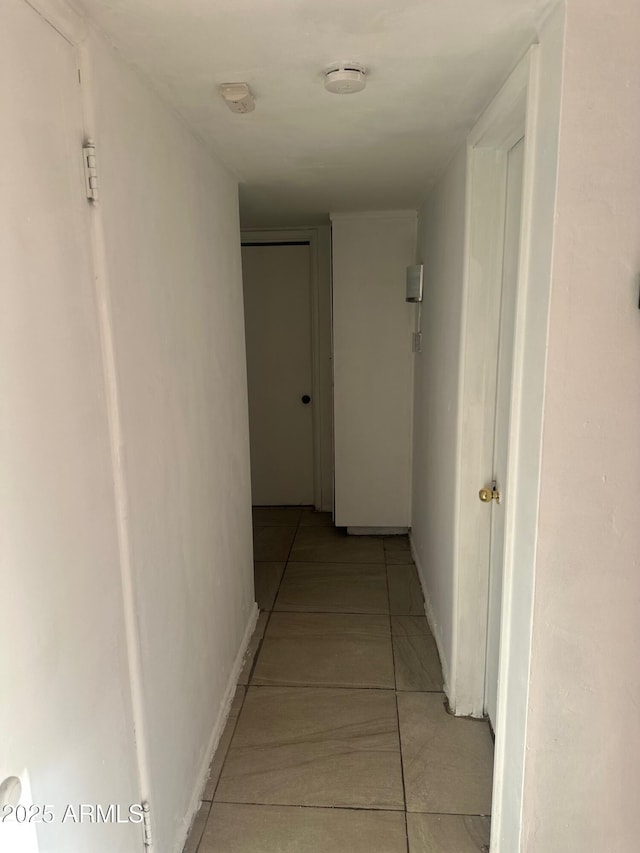 hallway with light tile patterned flooring