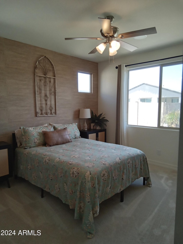 carpeted bedroom with ceiling fan