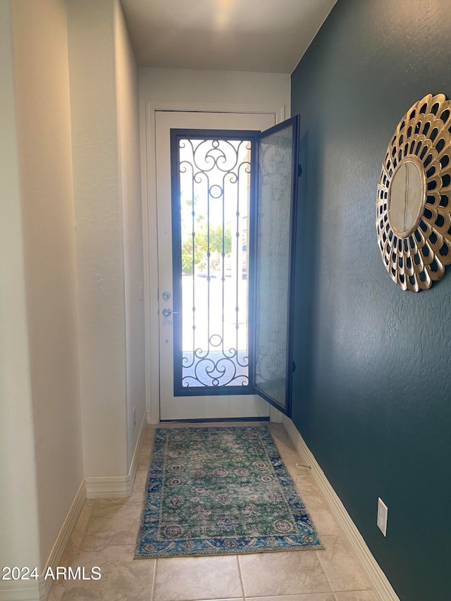 doorway featuring light tile patterned floors