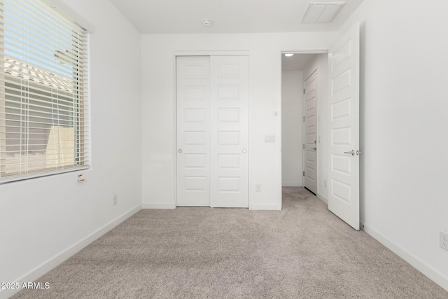 3815 S 64th Ln, Phoenix, AZ 85043 - unfurnished bedroom with carpet flooring, a closet, and baseboards