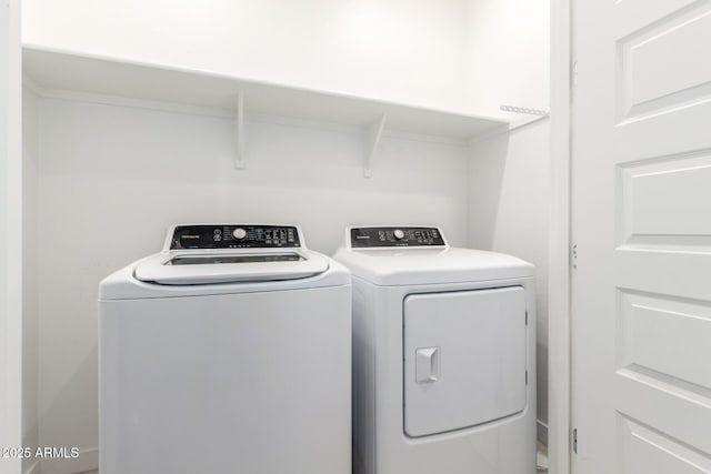 3815 S 64th Ln, Phoenix, AZ 85043 - clothes washing area with separate washer and dryer
