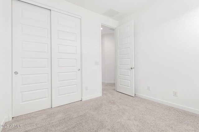 3815 S 64th Ln, Phoenix, AZ 85043 - unfurnished bedroom featuring carpet floors, a closet, and baseboards