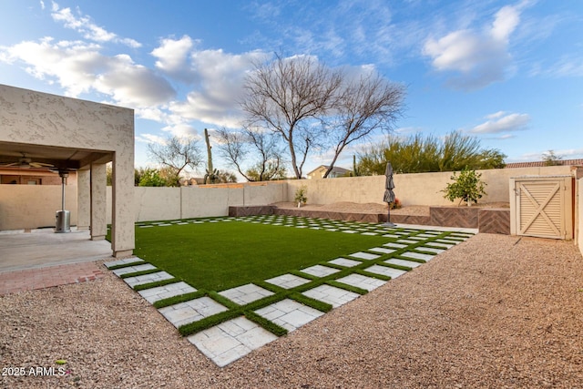 view of yard featuring a fenced backyard and a patio