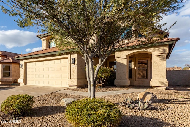 view of front facade featuring concrete driveway and stucco siding