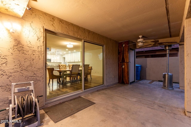 interior space featuring ceiling fan