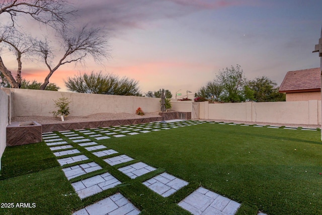 view of yard with a fenced backyard