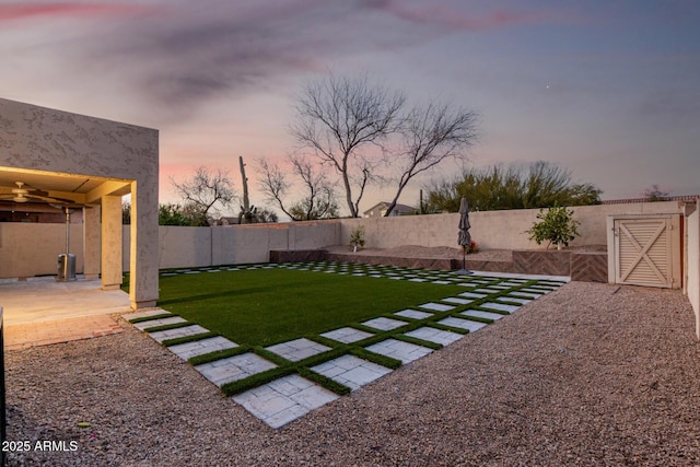 view of yard with a patio area and a fenced backyard