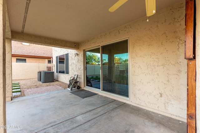 view of patio featuring fence and central AC