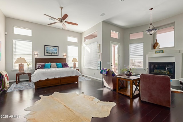 bedroom with dark wood-type flooring and ceiling fan