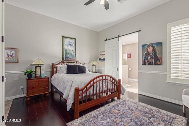 bedroom featuring ceiling fan, a barn door, dark hardwood / wood-style flooring, and multiple windows