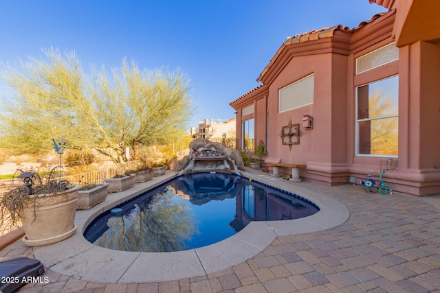 view of pool featuring a patio