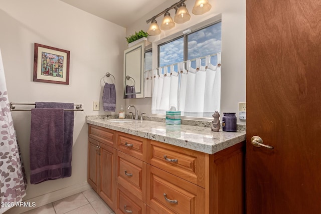 bathroom featuring tile patterned floors and vanity