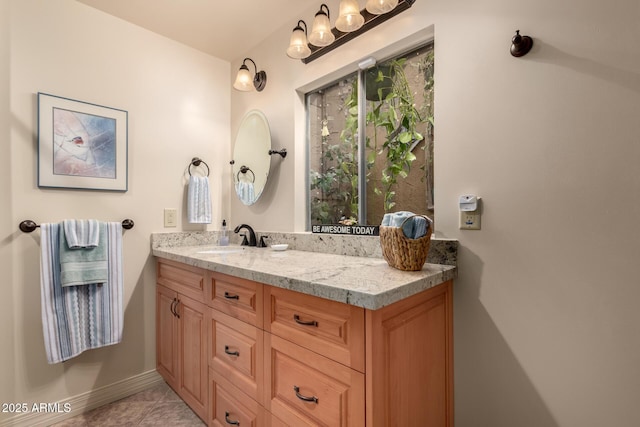 bathroom with tile patterned flooring and vanity