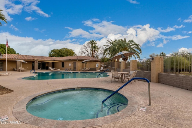 view of pool featuring a community hot tub and a patio