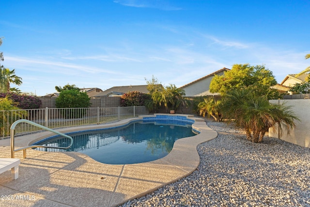 view of swimming pool with a patio area, a fenced backyard, and a fenced in pool