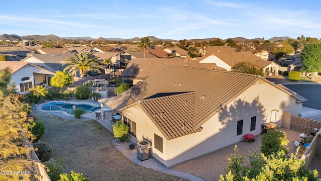 drone / aerial view featuring a residential view and a mountain view