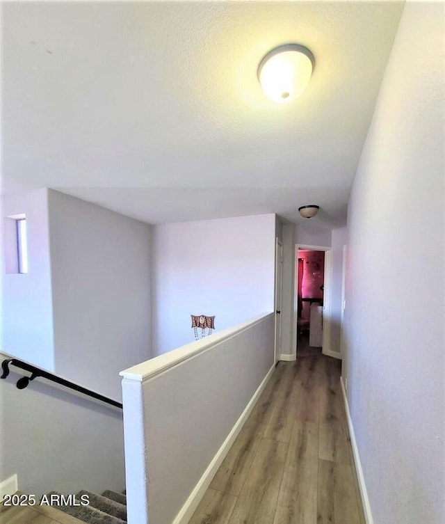 corridor featuring light hardwood / wood-style floors