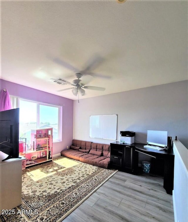 office featuring ceiling fan and light wood-type flooring