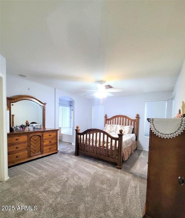 carpeted bedroom with ceiling fan