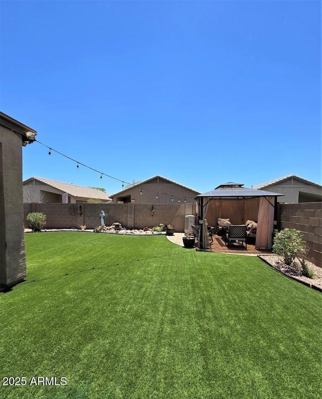 view of yard with a gazebo, an outdoor hangout area, and a patio area