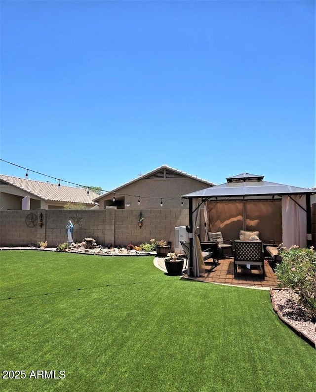 view of yard featuring a gazebo, outdoor lounge area, and a patio