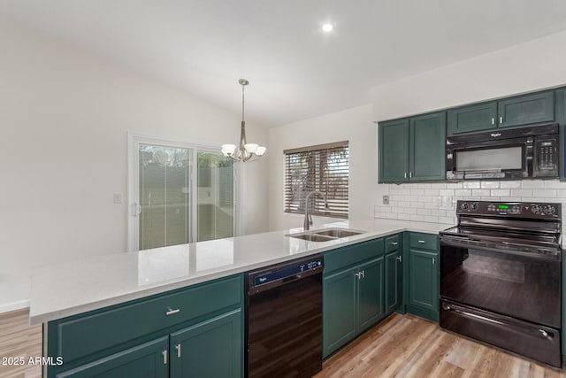 1047 W Laguna Dr, Tempe, AZ 85282 - kitchen with black appliances, a sink, a peninsula, light wood-type flooring, and a chandelier