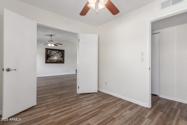 1047 W Laguna Dr, Tempe, AZ 85282 - unfurnished room with ceiling fan, wood finished floors, and baseboards