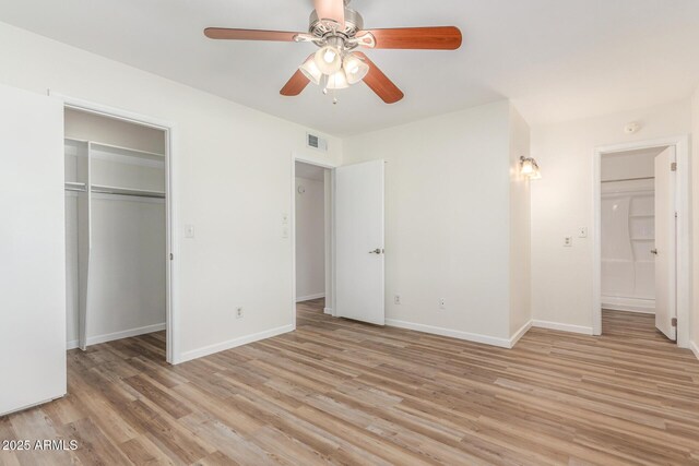 1047 W Laguna Dr, Tempe, AZ 85282 - unfurnished bedroom featuring light wood-type flooring, baseboards, a closet, and ceiling fan