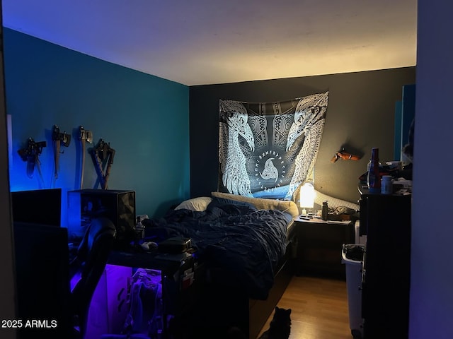 bedroom featuring wood finished floors