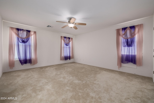 carpeted empty room with ceiling fan