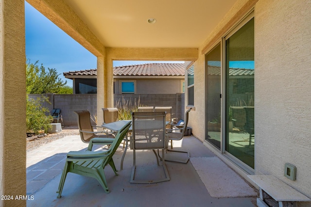 view of patio / terrace featuring fence and outdoor dining space