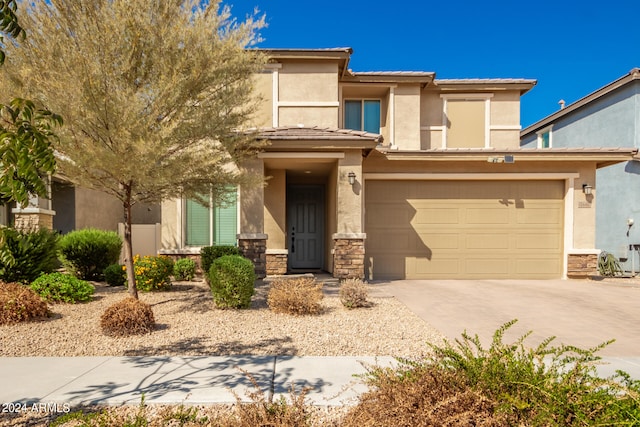 view of front of property with a garage