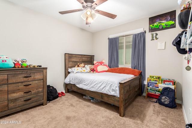 bedroom featuring light carpet and ceiling fan