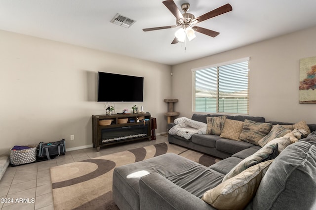 tiled living room with ceiling fan