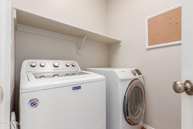 washroom featuring washer and clothes dryer