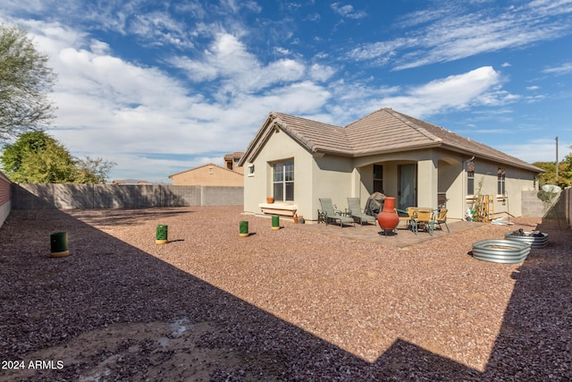 rear view of house featuring a patio area