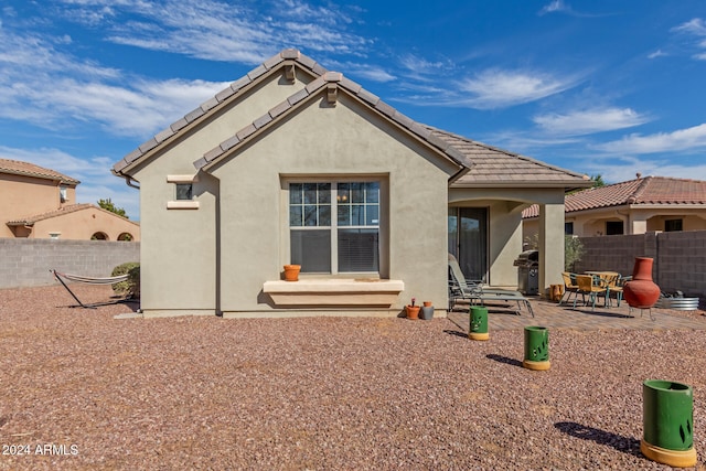 back of house featuring a patio