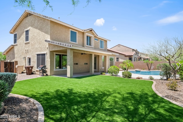 31221 N 130th Ln, Peoria, AZ 85383 - rear view of house featuring stucco siding, ceiling fan, and a patio