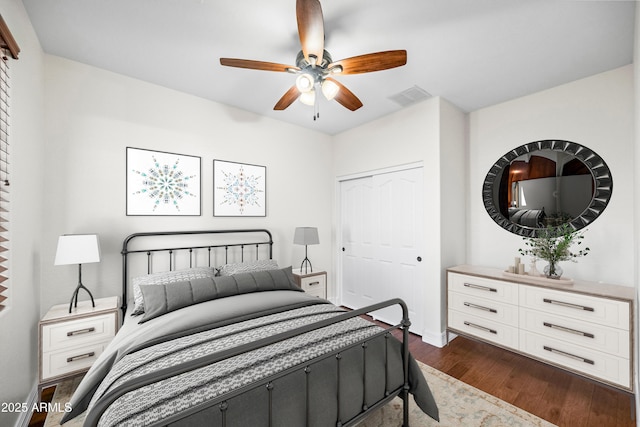 31221 N 130th Ln, Peoria, AZ 85383 - bedroom with dark wood finished floors, a closet, baseboards, and a ceiling fan