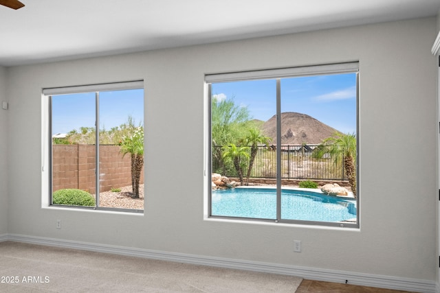 31221 N 130th Ln, Peoria, AZ 85383 - empty room with a mountain view, baseboards, and carpet flooring