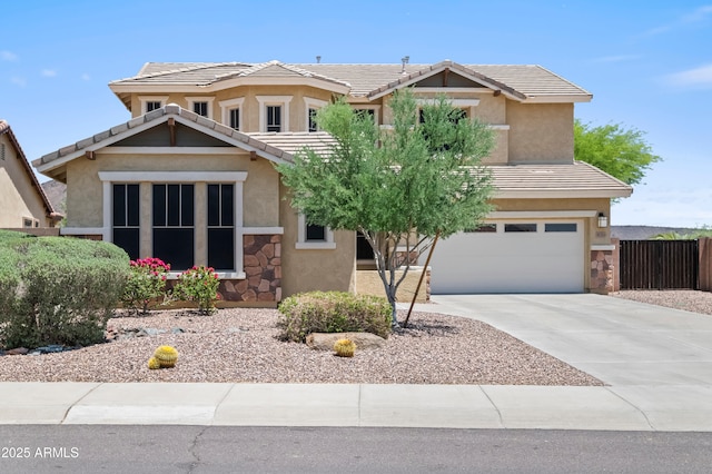 31221 N 130th Ln, Peoria, AZ 85383 - view of front of house featuring a garage, stucco siding, driveway, a tile roof, and stone siding