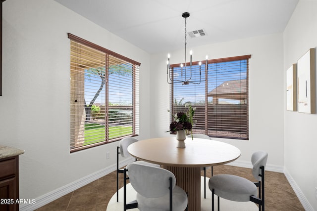 31221 N 130th Ln, Peoria, AZ 85383 - dining room with a chandelier, dark tile patterned floors, and baseboards