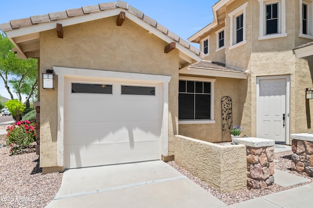 31221 N 130th Ln, Peoria, AZ 85383 - view of front of property featuring stucco siding, driveway, and an attached garage