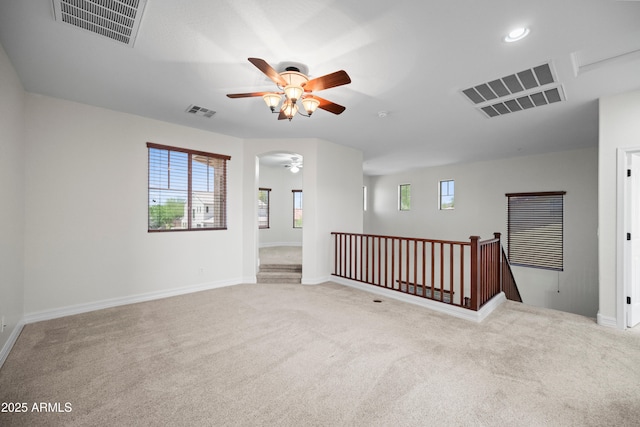 31221 N 130th Ln, Peoria, AZ 85383 - empty room featuring a ceiling fan, carpet flooring, baseboards, recessed lighting, and arched walkways
