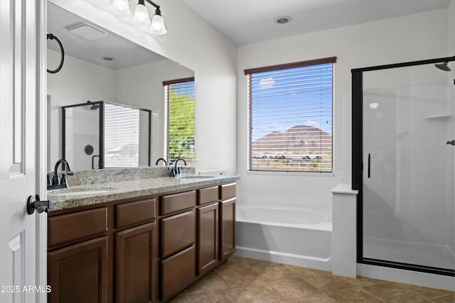 31221 N 130th Ln, Peoria, AZ 85383 - bathroom with a stall shower, a garden tub, double vanity, and tile patterned floors