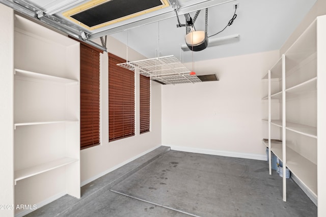 31221 N 130th Ln, Peoria, AZ 85383 - garage featuring a garage door opener and baseboards