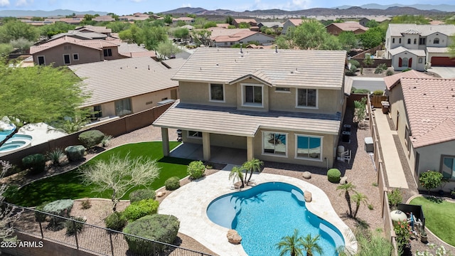 31221 N 130th Ln, Peoria, AZ 85383 - back of property with a fenced backyard, a residential view, stucco siding, a patio, and a mountain view